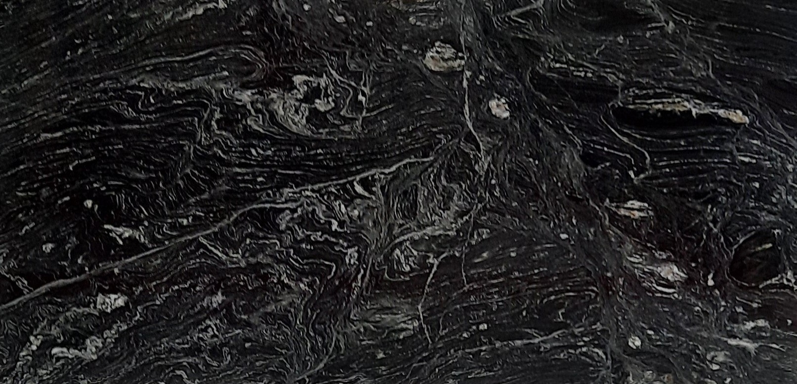 Épaisseur et finition de tranche du coloris Noir Caos en Granit Texta